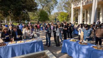 Attendees outside of the event getting light refreshments